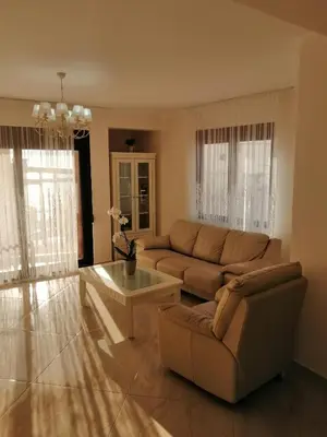 a living room with a couch and a coffee table at Sun&Sea Apartments in Dobra Voda