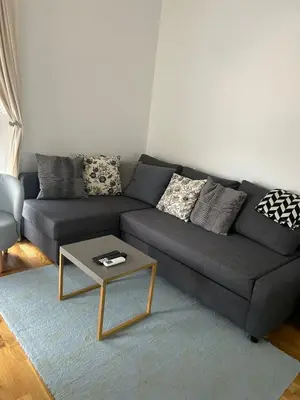 a living room with a couch and a coffee table at Apartment Cactus in Ulcinj