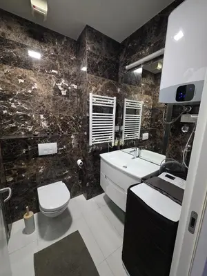 a bathroom with a sink and a toilet and a tub at Orenda Residences- Sea View Apartment in Budva