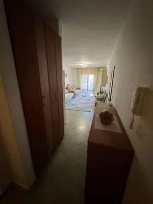 a room with a counter and a room with a hallway at Budva apartment in Budva
