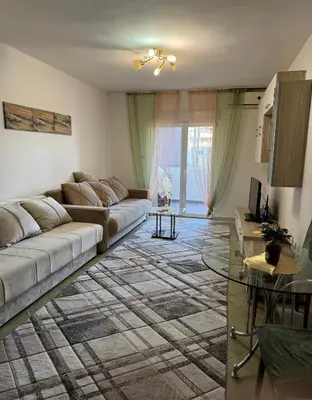a living room with a couch and a table at Budva apartment in Budva