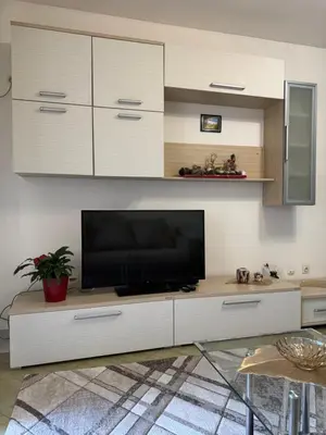 a living room with a flat screen tv on a entertainment center at Budva apartment in Budva