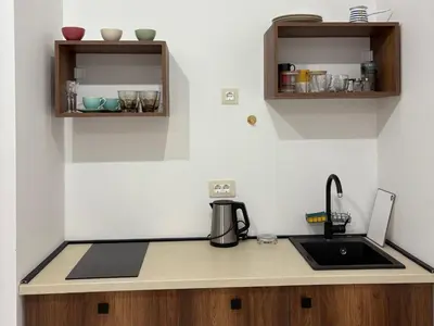 a kitchen with a sink and a coffee maker on a counter at Val Apartment, Przno in Budva
