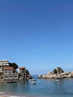 a group of boats in a body of water with buildings at Val Apartment, Przno in Budva