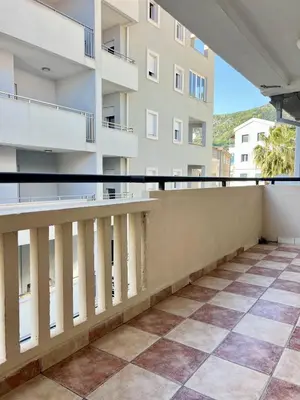 a balcony with a view of a building at Квартира in Budva