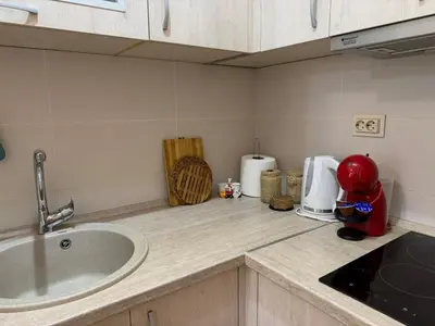 a kitchen with a sink and a counter top with a mixer at Modern Apartment Przno in Pržno