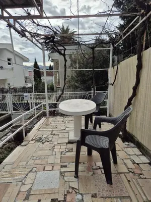 a table and two chairs on a patio at Amore Studio Apartment in Bar, Susanj
