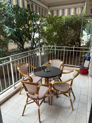 a patio with a table and chairs on a balcony at Njaro del Mar Petrovac Bay in Petrovac na Moru