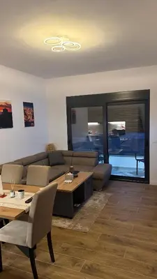 a living room with a couch and a table at Morea Apartments in Ulcinj