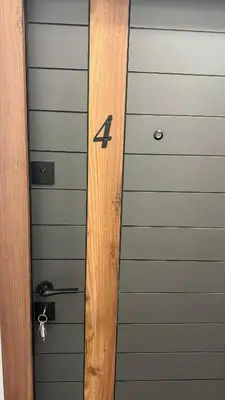 a wooden door with the number four on it at Morea Apartments in Ulcinj