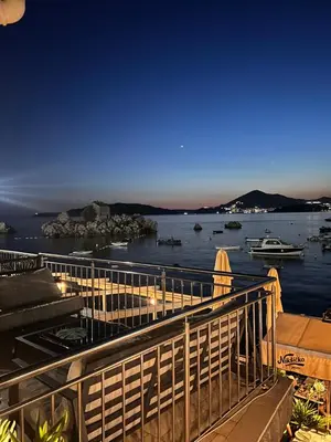 a view of a body of water at night at Villa Brodetto, Sveti Stefan in Pržno