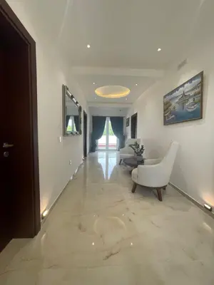 a living room with a couch and a chair at Apartments Amira in Ulcinj