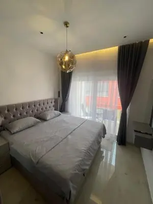 a bedroom with a large bed and a window at Apartments Amira in Ulcinj