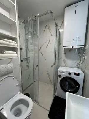 a bathroom with a shower and a toilet and a sink at Mayne Apartmant in Budva