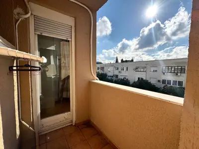 a balcony with a view of a building at The Government District Suite in Podgorica