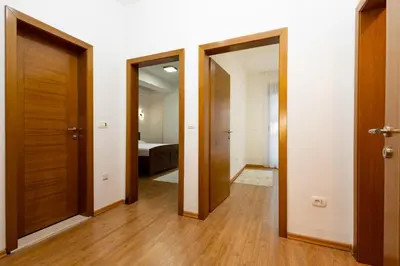 an empty hallway with two doors and a bedroom at Apartment sea view Asija in Bar