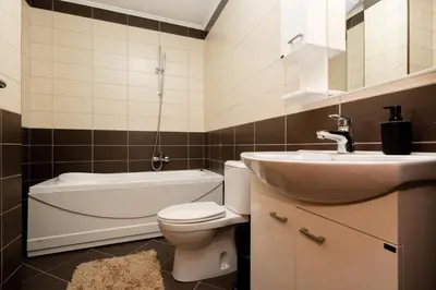 a bathroom with a white toilet and a sink at Apartment sea view Asija in Bar