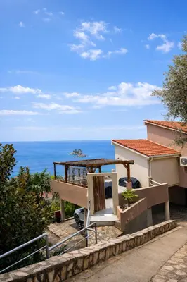a view of the ocean from the balcony of a house at Blue Vista in Petrovac na Moru