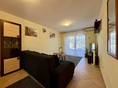 a living room with a couch and a table at Panoramic Sea View - Two Bedroom Apartment - Budva Center in Budva
