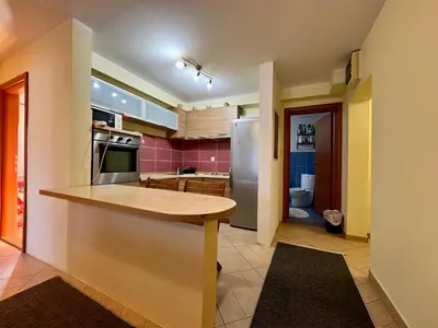 a kitchen with a counter and a refrigerator at Panoramic Sea View - Two Bedroom Apartment - Budva Center in Budva