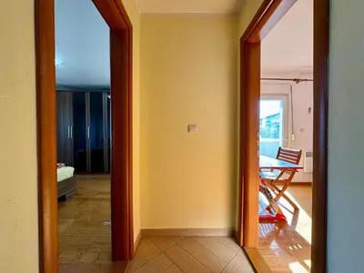 a hallway with a mirror and a dining room at Panoramic Sea View - Two Bedroom Apartment - Budva Center in Budva