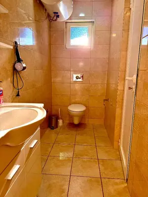 a bathroom with a toilet and a sink at Adriatic Stay Apartments in Budva