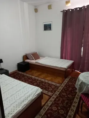 a living room with two beds and a couch at Apartman Nikoleta in Kotor