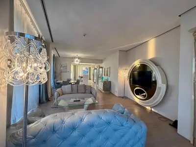 a living room with a couch and a tv in it at Exclusive Luxury Villa in Dukley Gardens in Budva