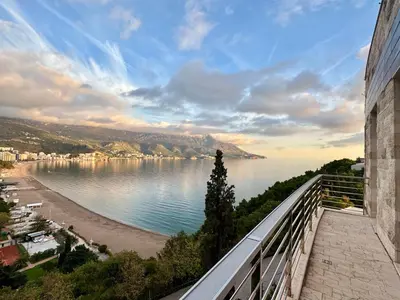 a view of a beach and the ocean from a building at Exclusive Luxury Villa in Dukley Gardens in Budva