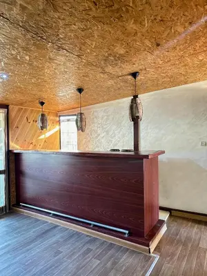 a wooden counter in a room with a ceiling at Amazonas Pirates 3 in Ulcinj