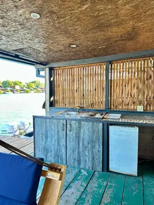 a deck of a boat with a table and a chair at Amazonas Pirates 3 in Ulcinj
