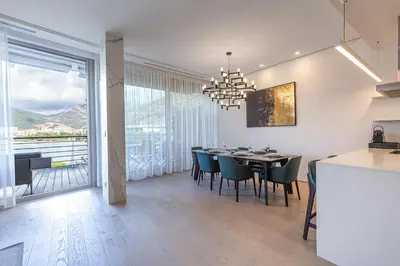 a kitchen and dining room with a table and chairs at Luxury Dukley Villa in Boreti