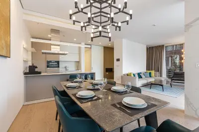a dining room and living room with a table and chairs at Luxury Dukley Villa in Boreti