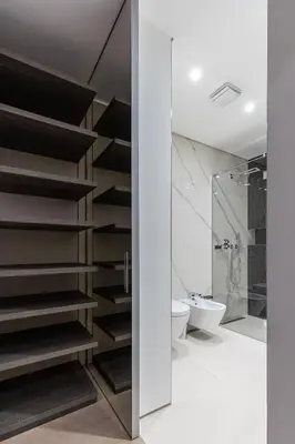 a bathroom with black stairs and a toilet at Luxury Dukley Villa in Boreti