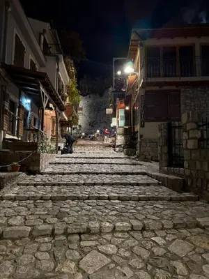 a cobblestone street in a town at night at Villa & Pool in Utjeha