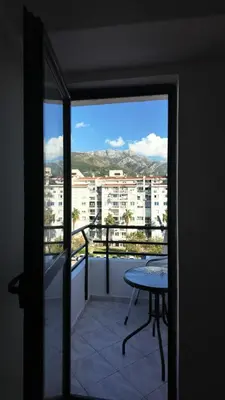 a balcony with a table and a view of a city at Central Studio Apartment in Bar