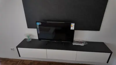 a flat screen tv sitting on top of a counter at Central Studio Apartment in Bar