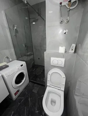 a bathroom with a toilet and a shower at rent stan sutomore in Sutomore