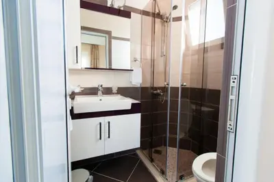 a bathroom with a sink and a shower at A3 Apartments in Ulcinj