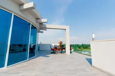 a balcony of a house with a table and chairs at A3 Apartments in Ulcinj