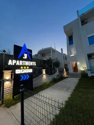 a sign in front of a house at A3 Apartments in Ulcinj
