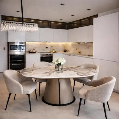 a kitchen with a marble table and chairs at Sea view luxury apart in Tq plaza in Budva