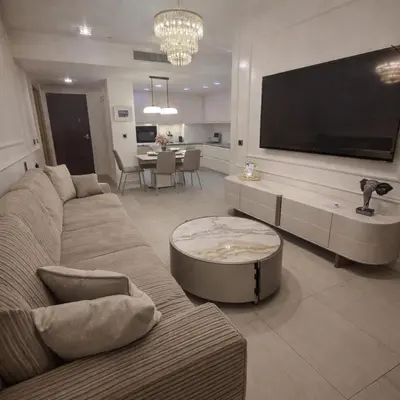 a living room with a couch and a tv at Sea view luxury apart in Tq plaza in Budva