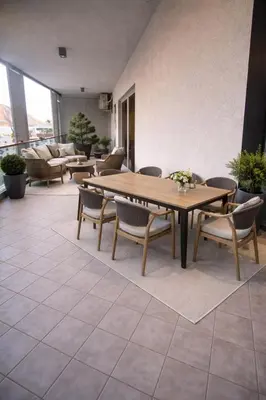 a dining room with a table and chairs at Sea view luxury apart in Tq plaza in Budva