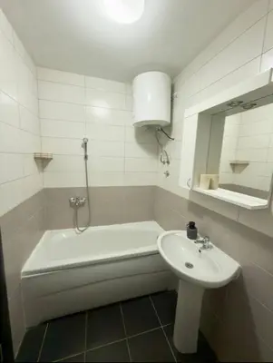 a bathroom with a bath tub and a sink at ADAIST Apartments Budva Free Parking & Balcony in Budva