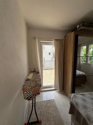 a room with a bedroom with a bed and a window at Radon apartments in Dobra Voda