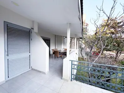 an external view of a house with a balcony at Flat in Budva with terrace and private garden in Budva
