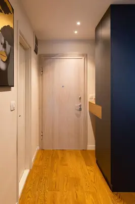 a hallway with a wooden floor and a door at Tramonto City Center Apt with Sea View and Garage in Bar