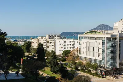 a view of a city with buildings and trees at Tramonto City Center Apt with Sea View and Garage in Bar