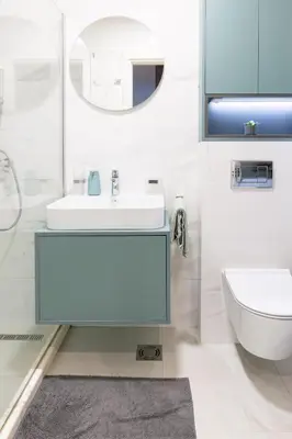 a bathroom with a sink and a toilet and a mirror at Tramonto City Center Apt with Sea View and Garage in Bar